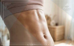 Primer plano cinematográfico del resultado: un abdomen perfectamente plano y esculpido.