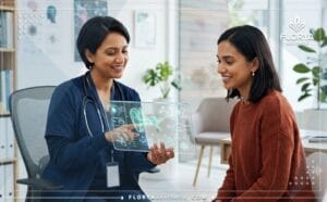 صورة توضح أفضل دكتور تكبير الأذن في تركيا وهو يشرح خطة العلاج باستخدام تقنيات رقمية حديثة.
